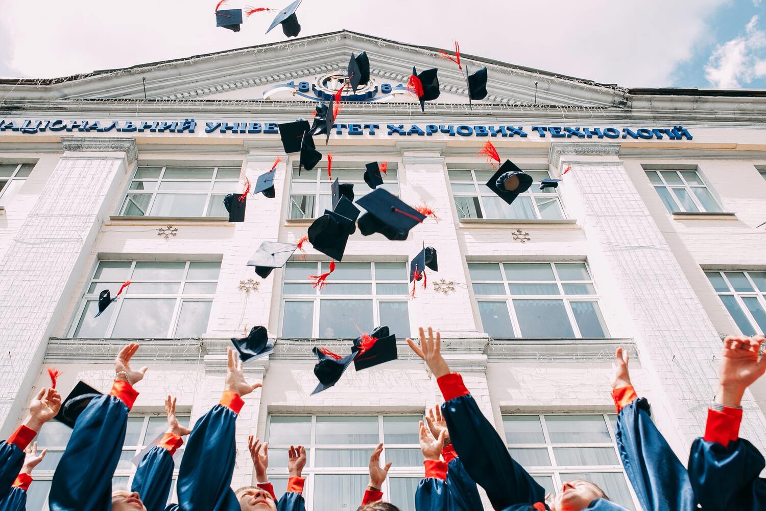 College Graduates throwing caps in the air.