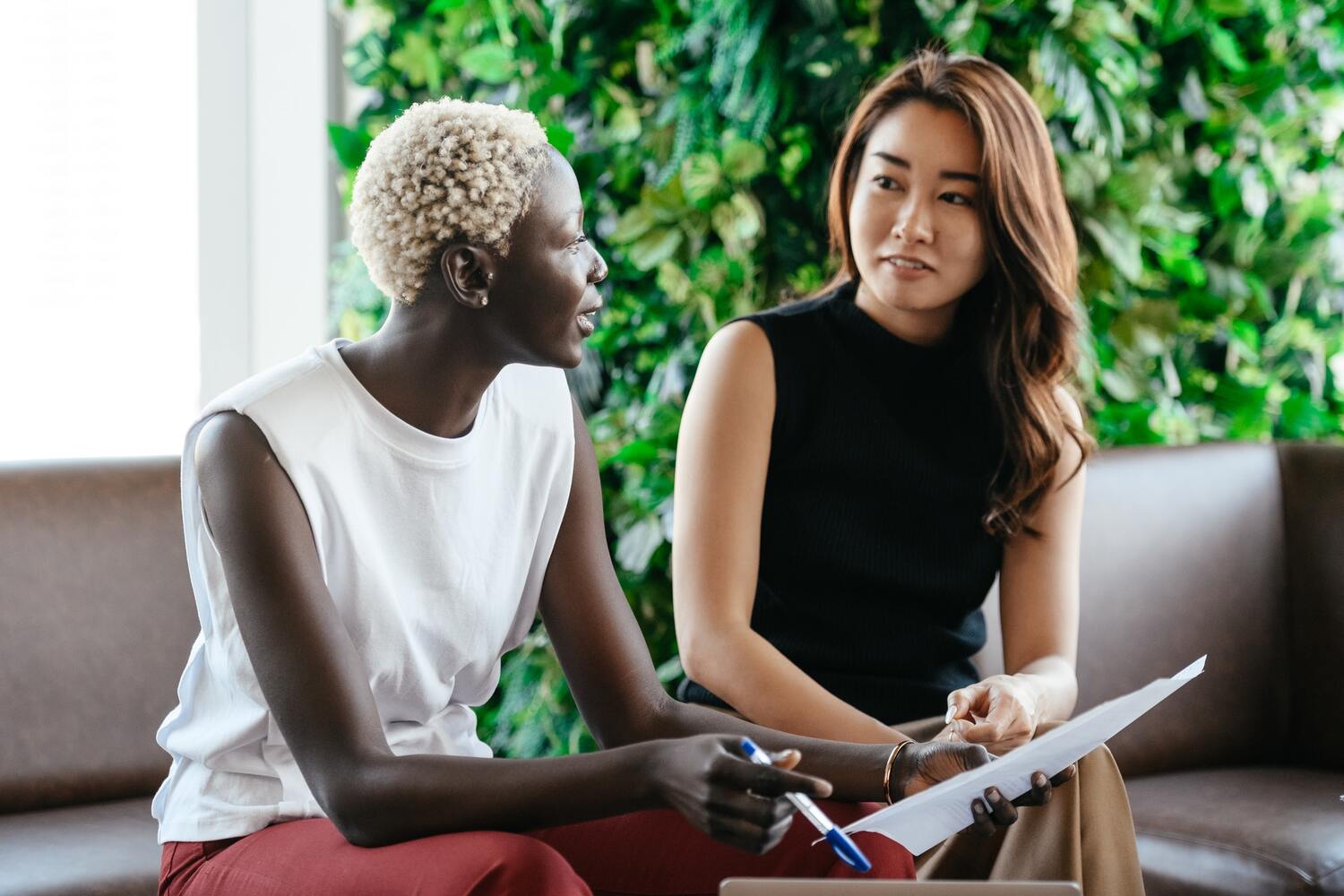 Two women negotiating a house price.