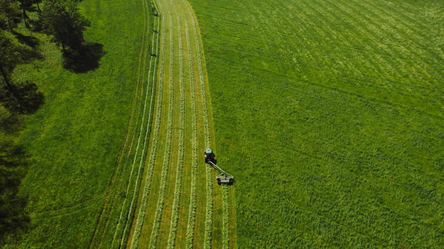 Size of an acre of land with a tractor on it.