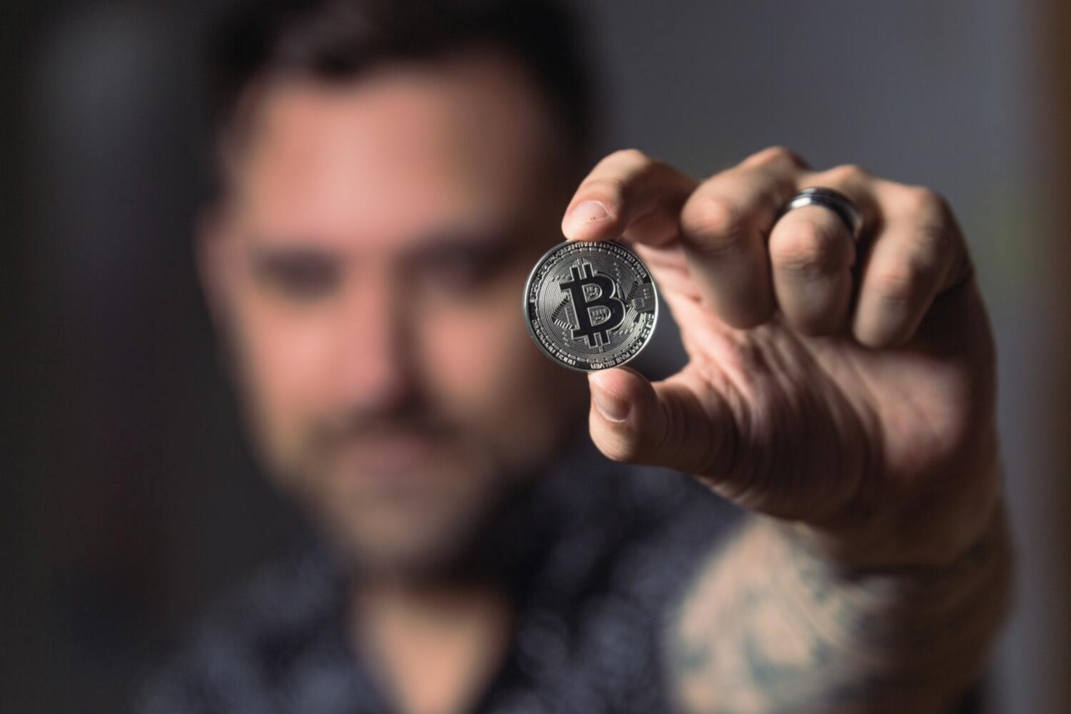 Bitcoin ETF in a man's hand.