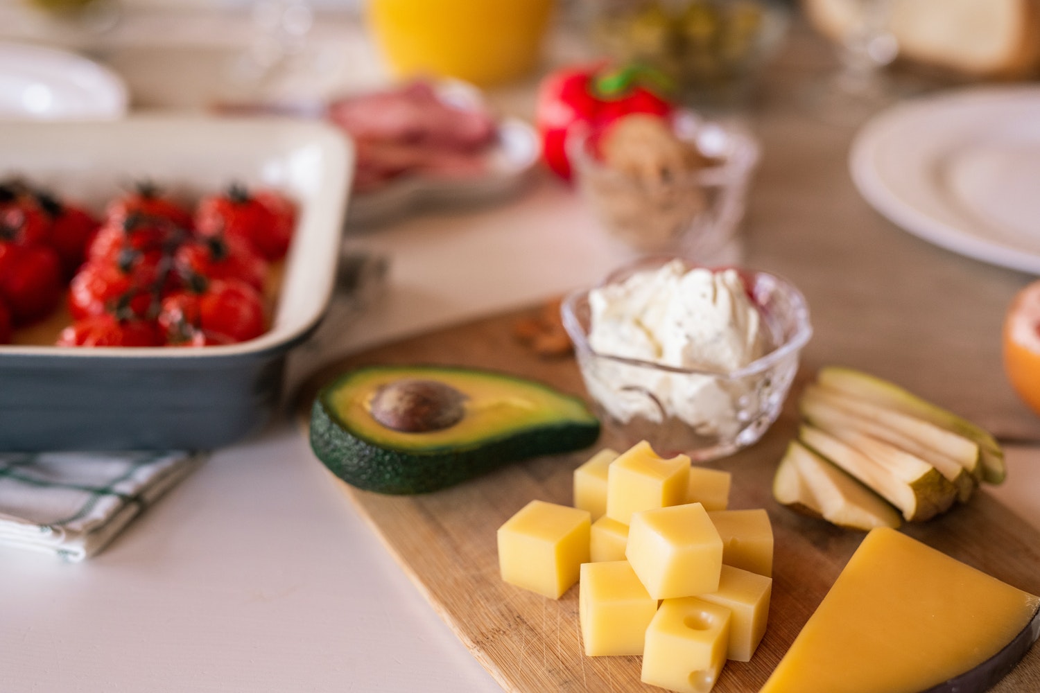 Healthy snacks cut up on a plater on the table.