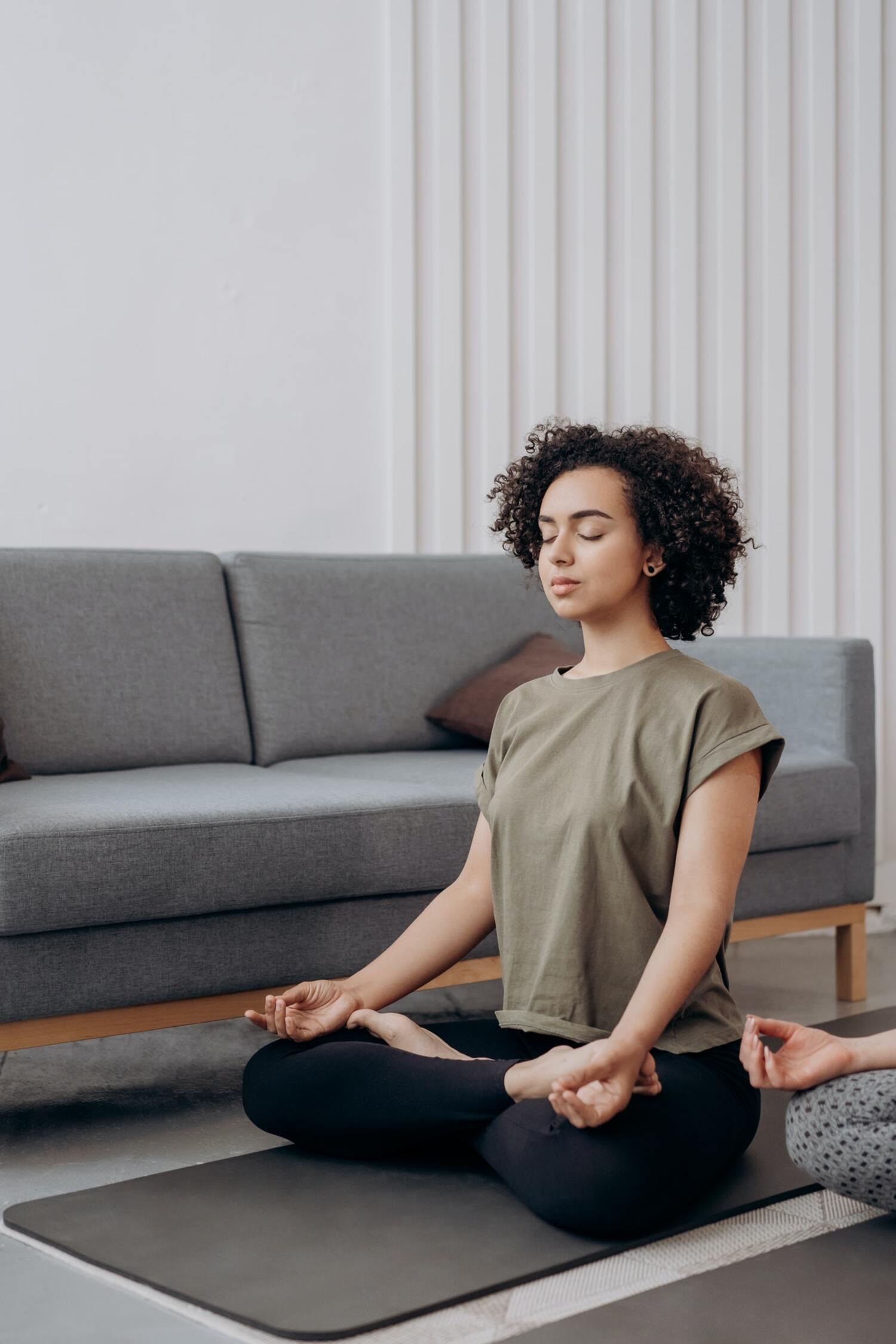 A women practicing self discipline in a yoga pose.