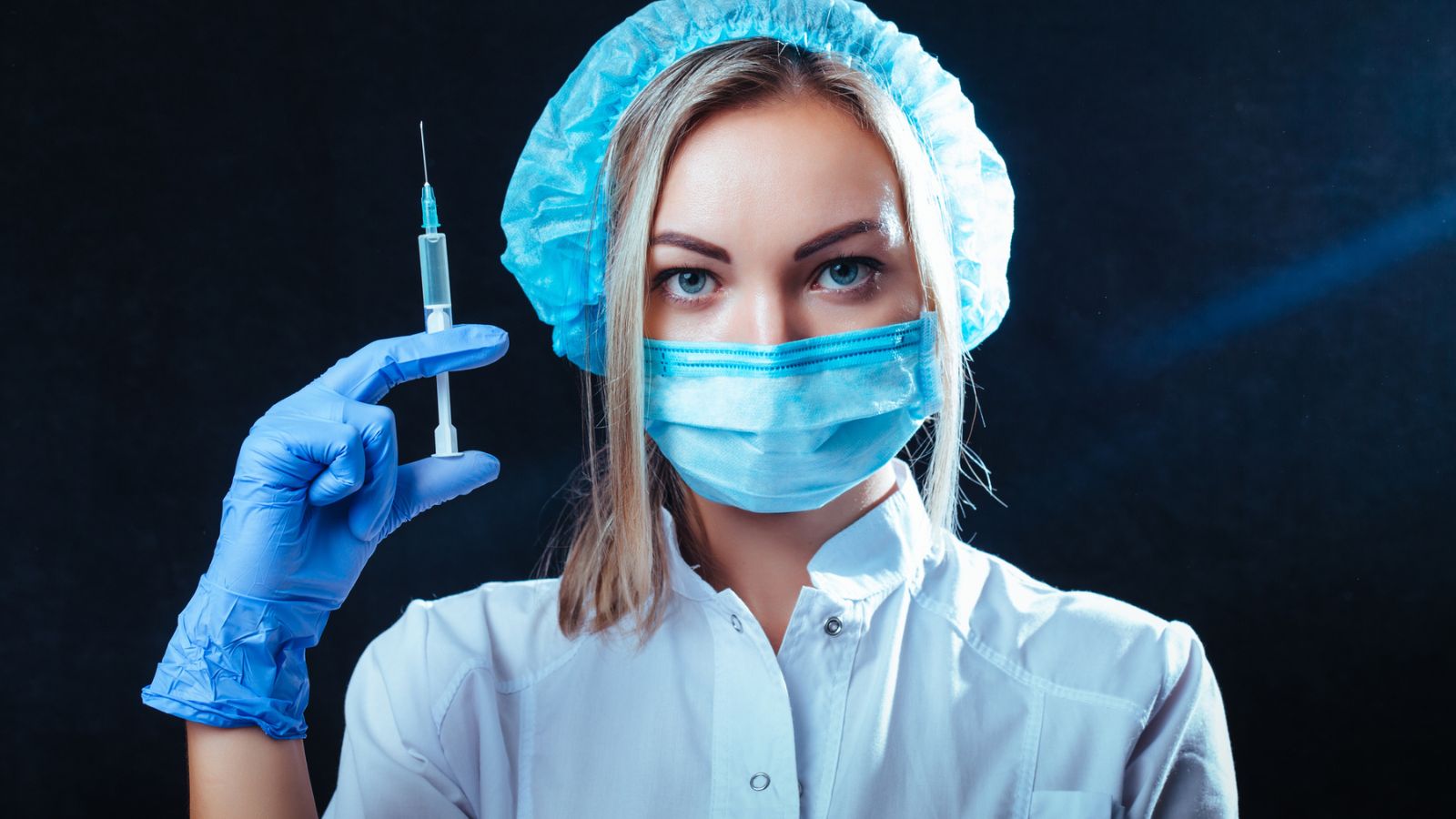woman doctor with syringe needle