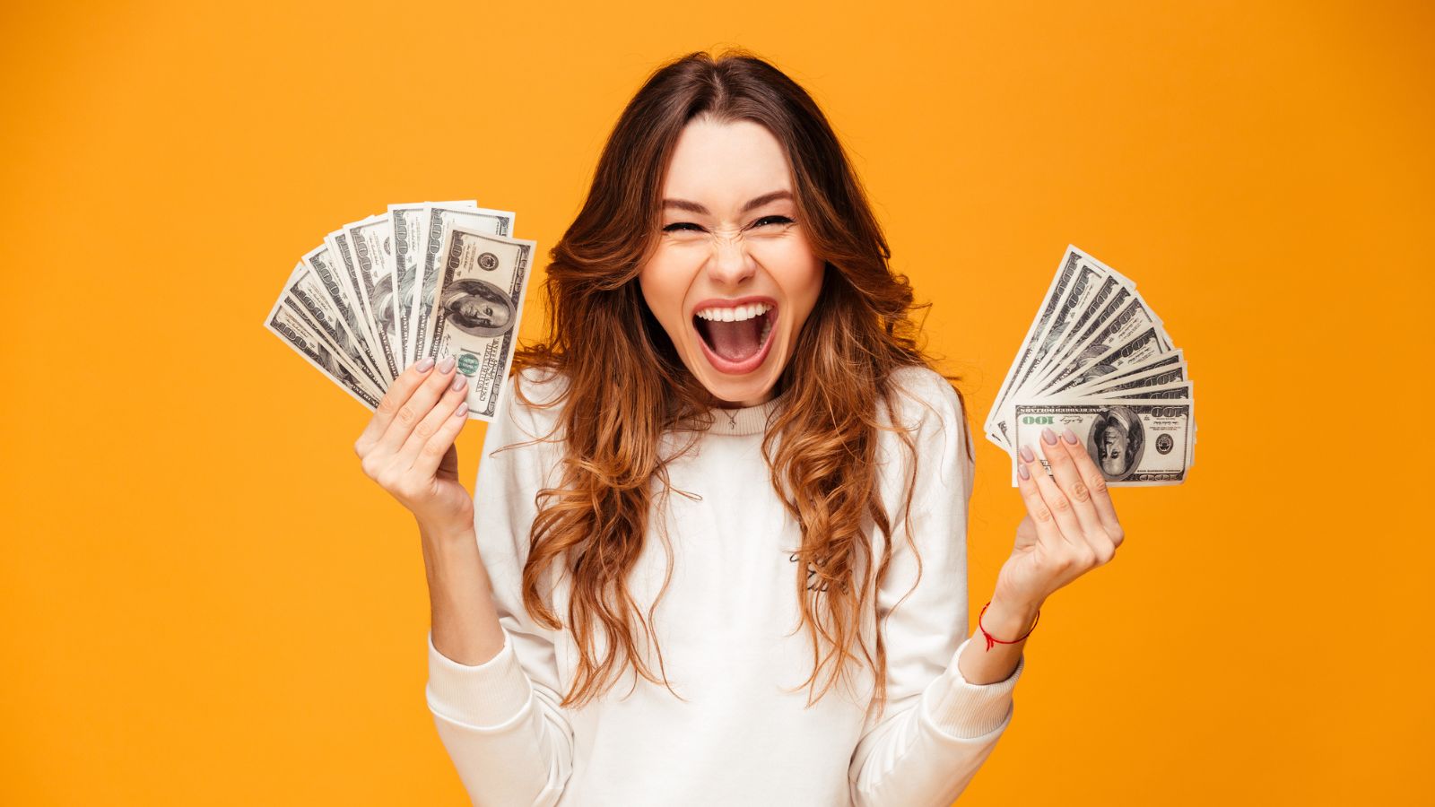 woman happy screaming with money