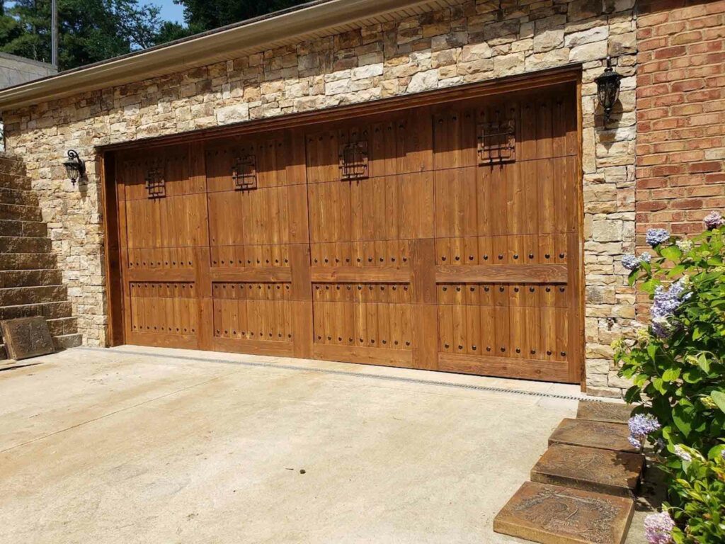 Rustic Spanish style wood garage door.