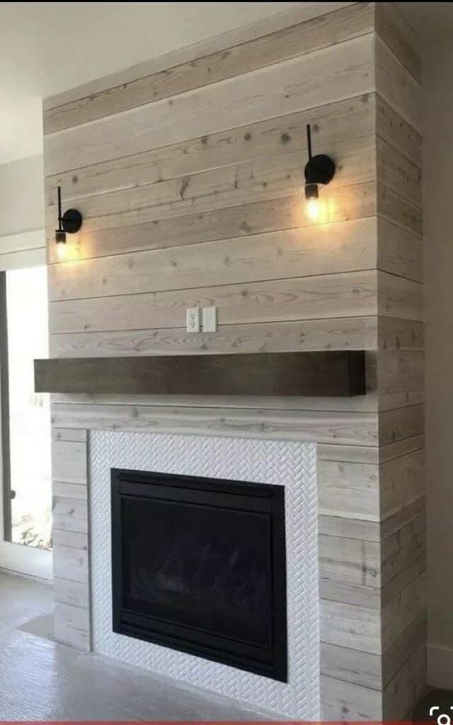 Stained wood shiplap fireplace.