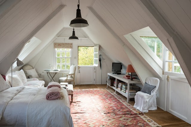 Attic bedroom with windows.