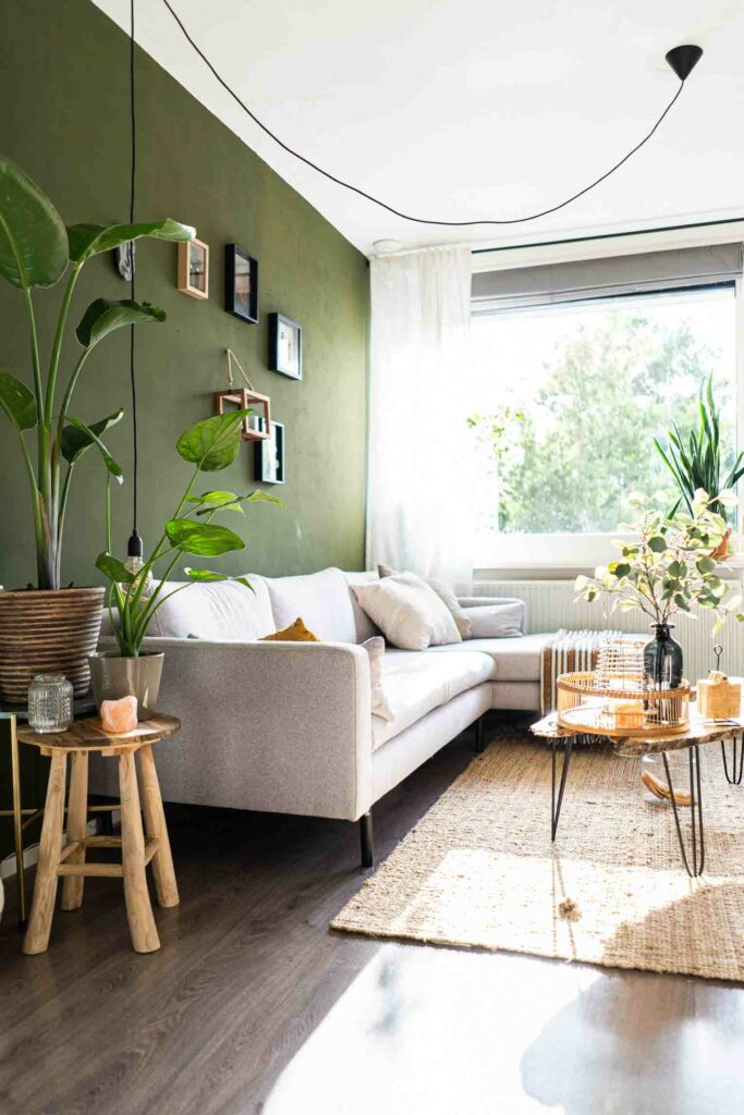 Green living room with large window.