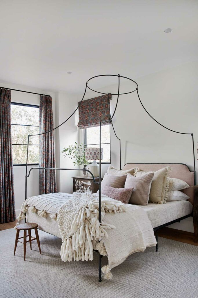 Canopy bed in Spanish style bedroom.