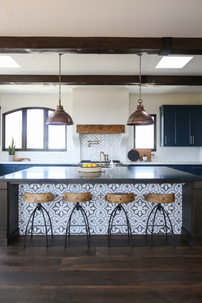 Spanish style kitchen with dark wood floors and countertops.