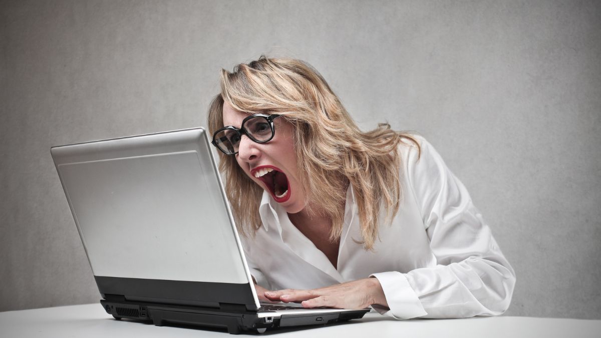 woman screaming at laptop