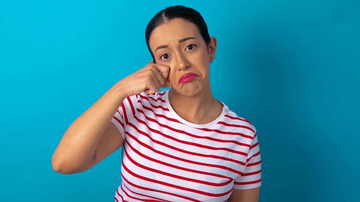 embarrassed woman wearing stripe shirt