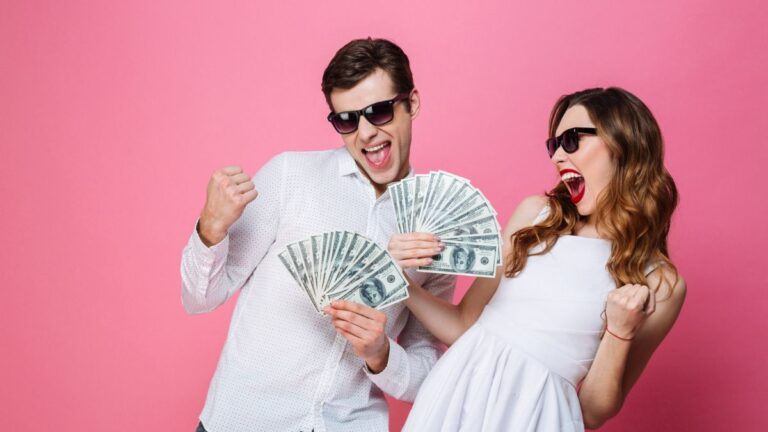 man and woman happy about money cash