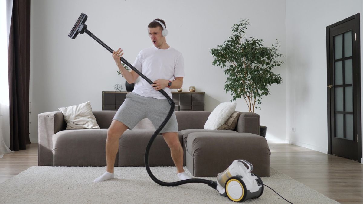man vacuuming