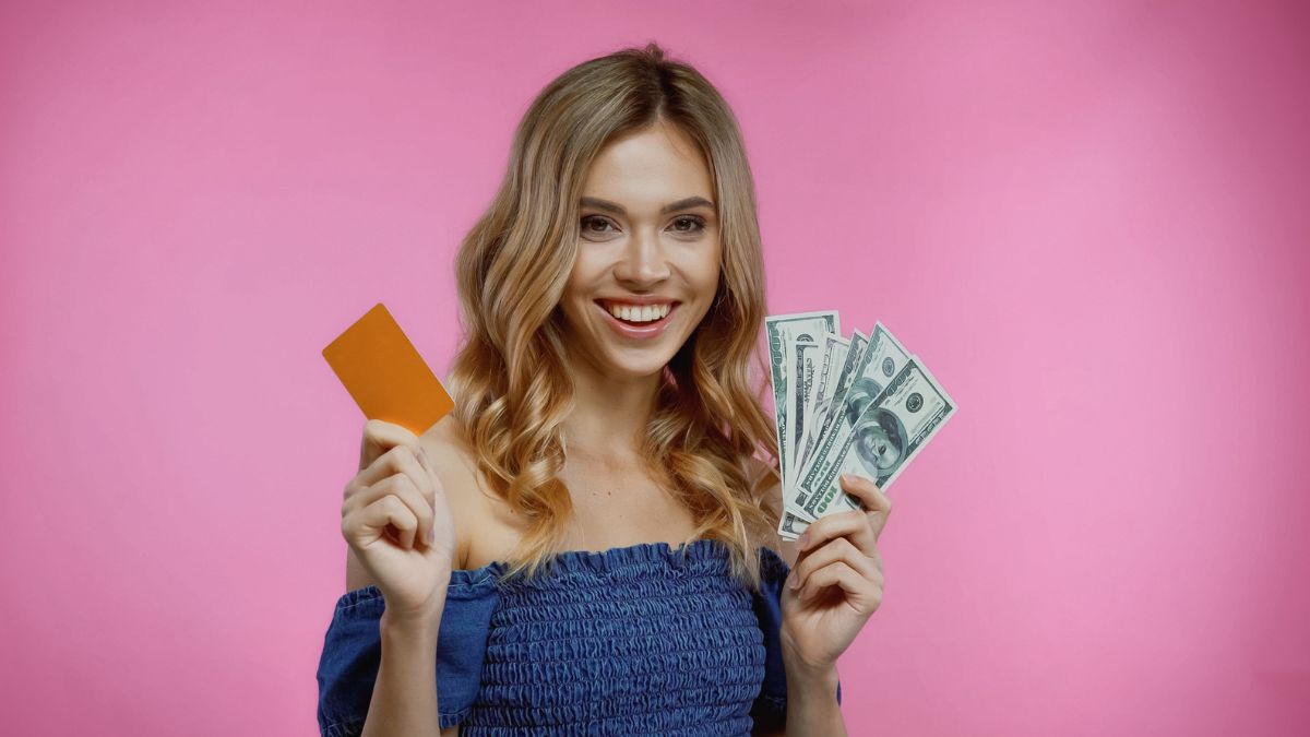 woman with a credit card and cash