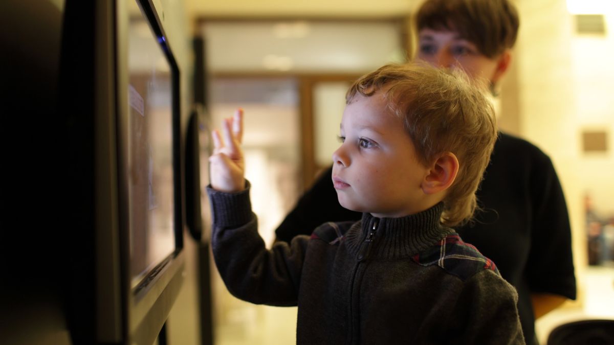 kid boy looking at tv