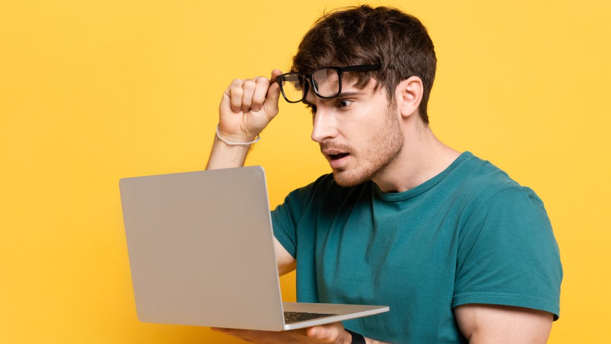 man with laptop and glasses