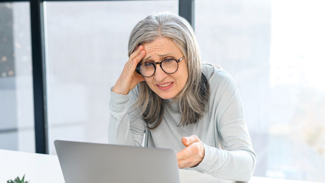 mature woman looking at her computer