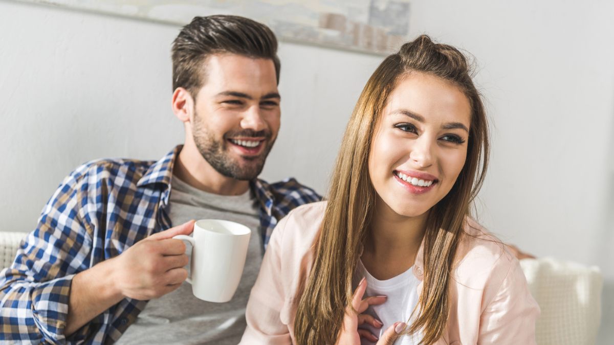 couple talking with cup of coffee