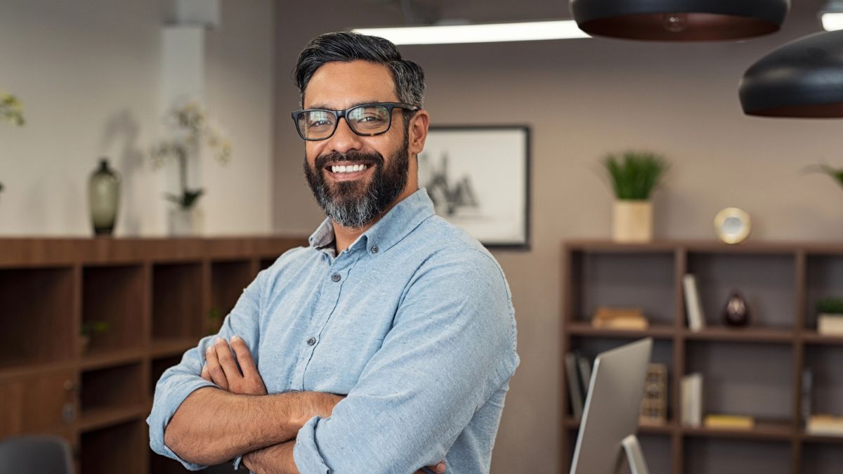man smiling with glasses