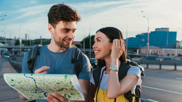 couple smiling on a map