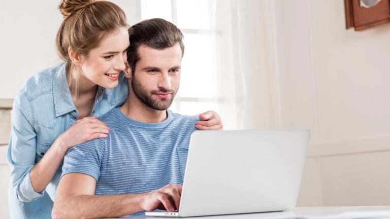 Couple using laptop