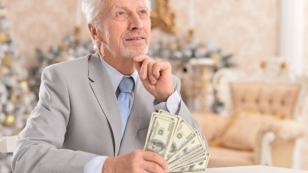 Senior businessman counting money