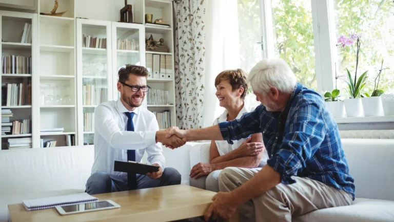 Financial advisor shaking hands with man