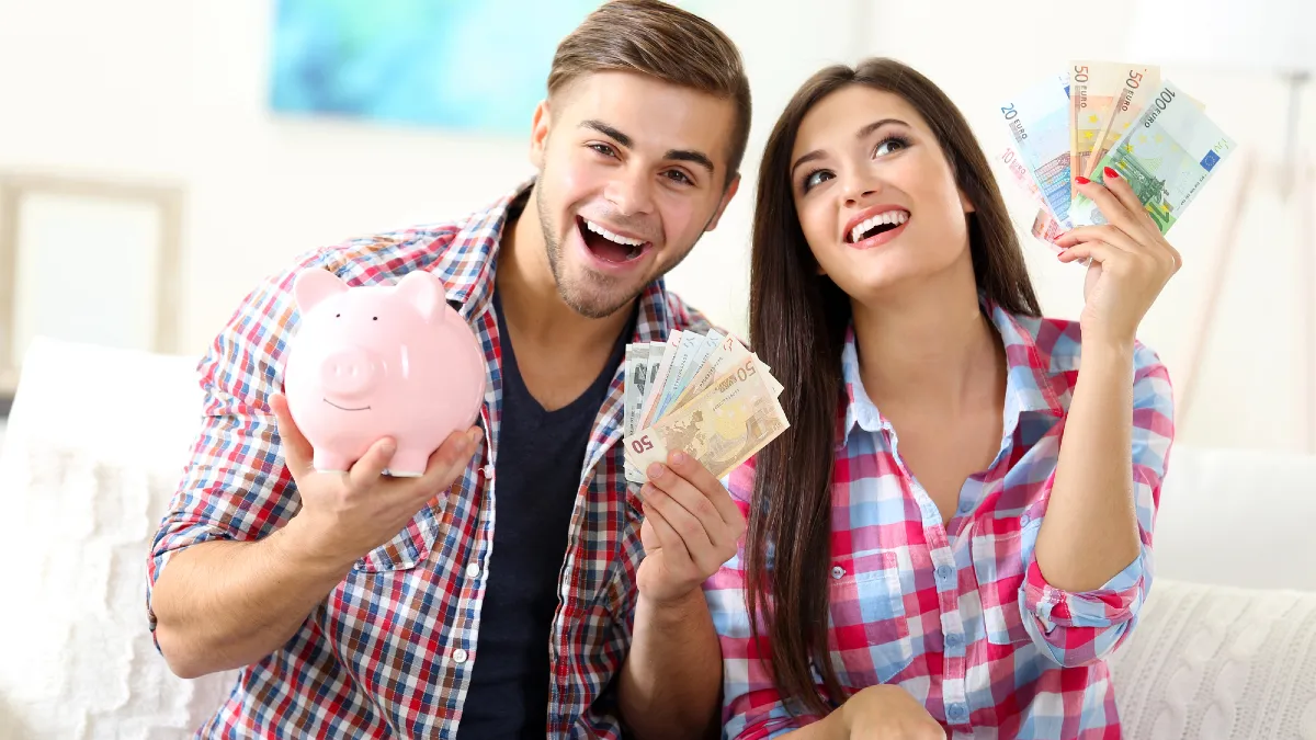 Happy couple counting money