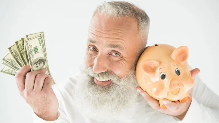 Man with dollars and piggy bank