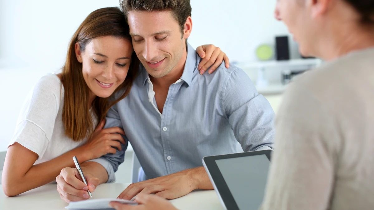 Couple signing real-estate contract