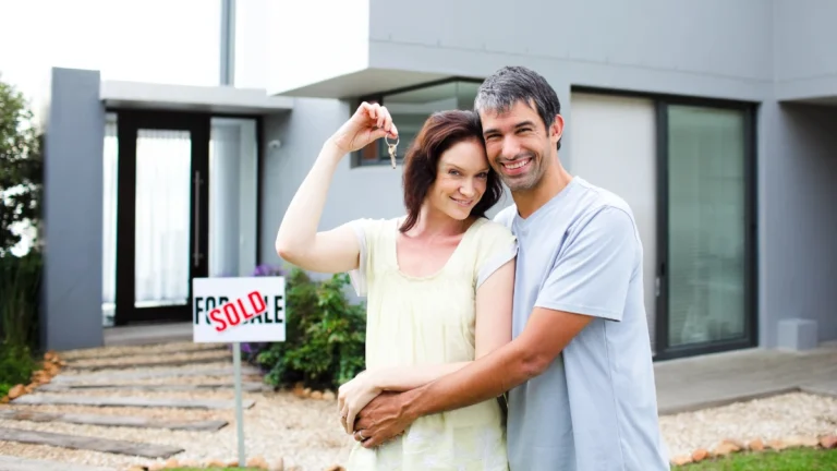 Happy couple after buying house