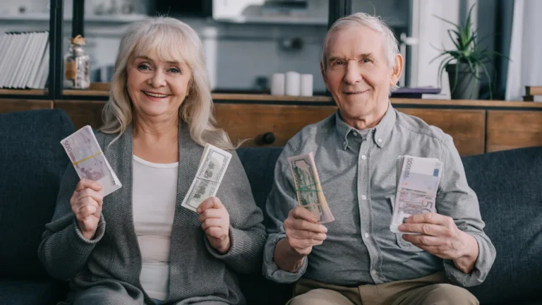 Happy senior couple sitting on couch,