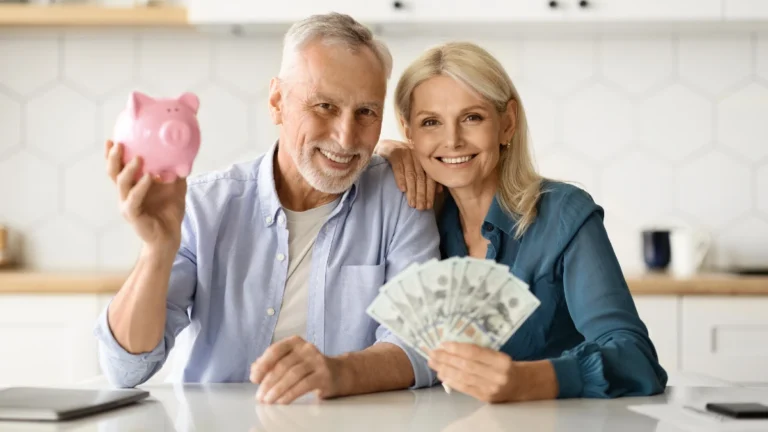 Investments Concept. Smiling Senior Couple Holding