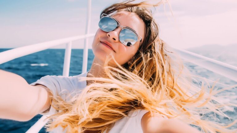 Woman taking a picture on a boat