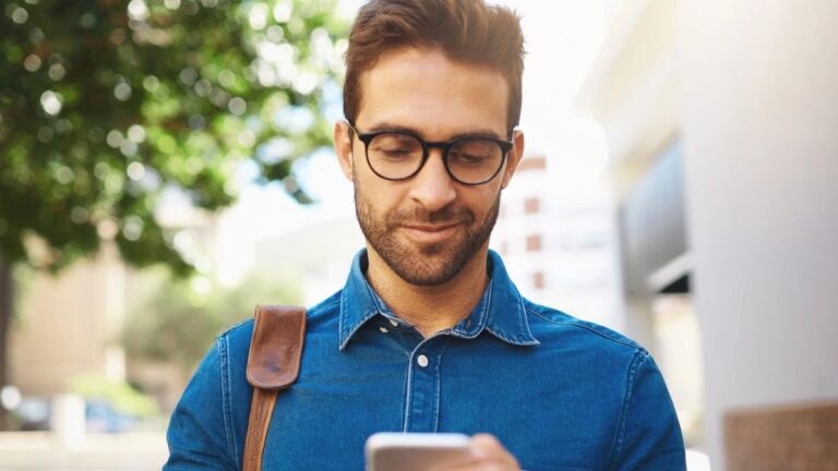 Man checking messages on his phone