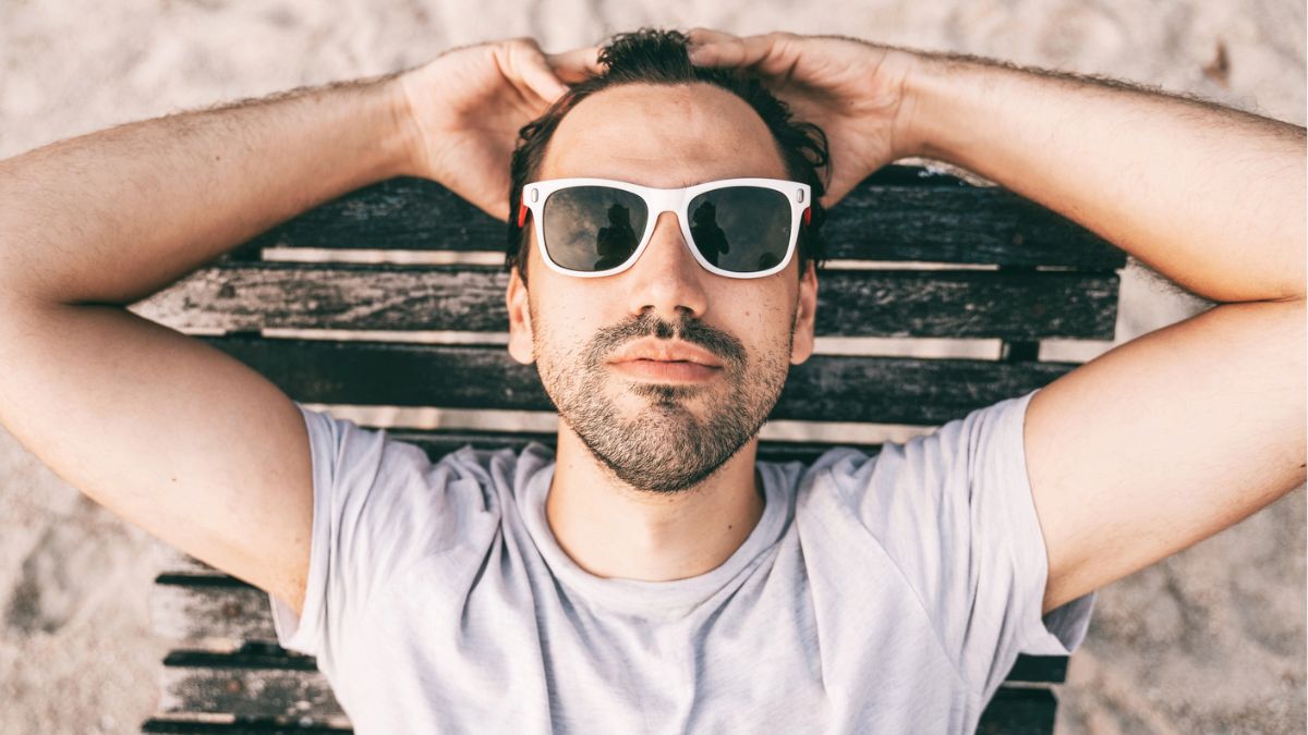 Man laying down on the beach