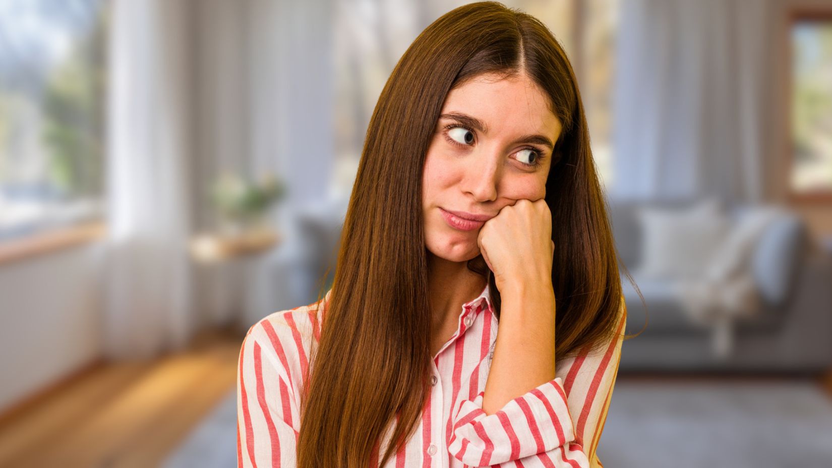 Woman thinking in her living room
